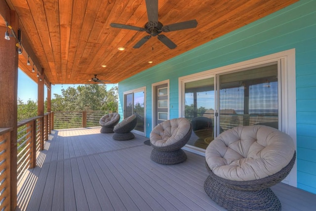 wooden terrace featuring ceiling fan