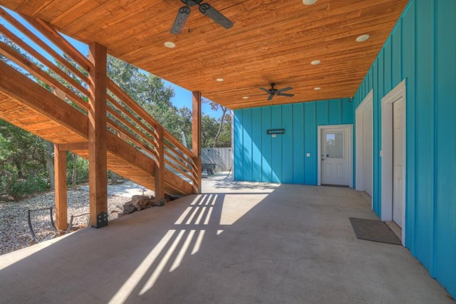 view of patio with fence and a ceiling fan