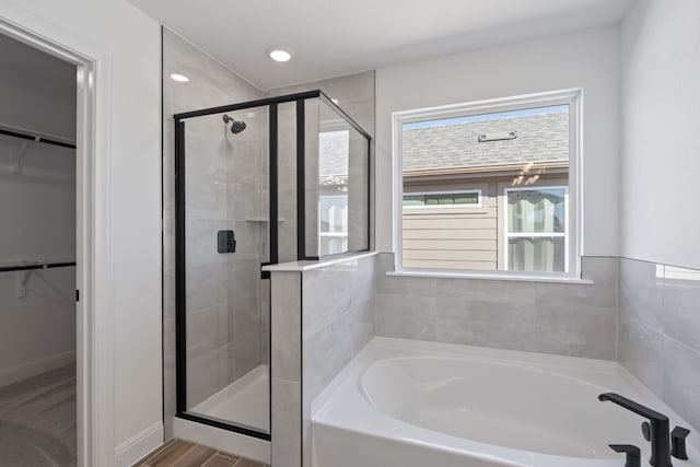 bathroom featuring plus walk in shower