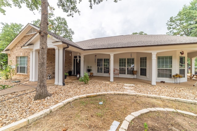 rear view of house with a patio