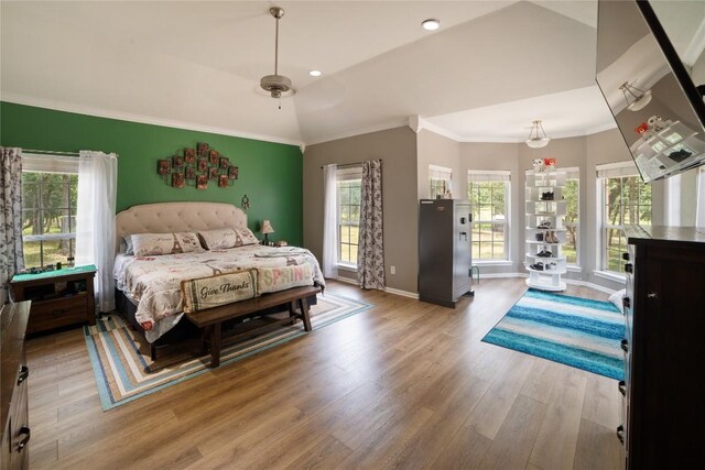 2600 Fm 2095, Cameron, TX 76520 - bedroom with wood finished floors, crown molding, baseboards, and vaulted ceiling
