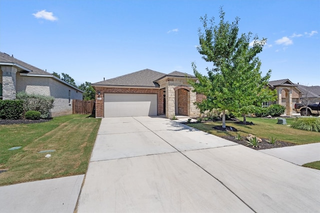 view of front facade with a front yard and a garage