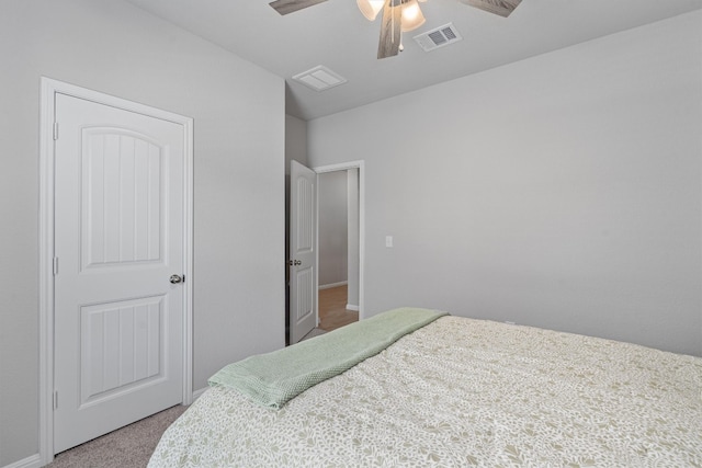 bedroom featuring ceiling fan and carpet