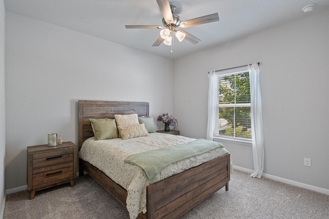 bedroom with ceiling fan and carpet floors