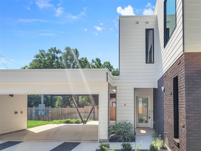 exterior space featuring a carport