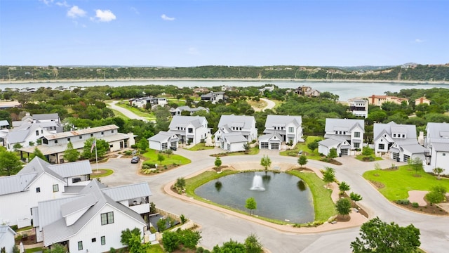 bird's eye view with a water view