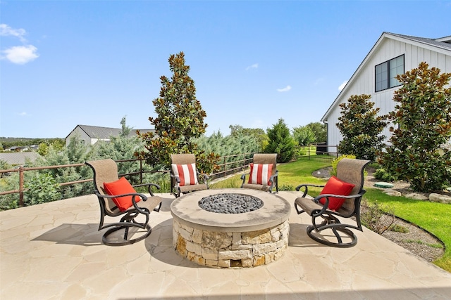 view of patio / terrace with an outdoor fire pit