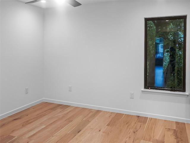 empty room featuring light hardwood / wood-style flooring and ceiling fan