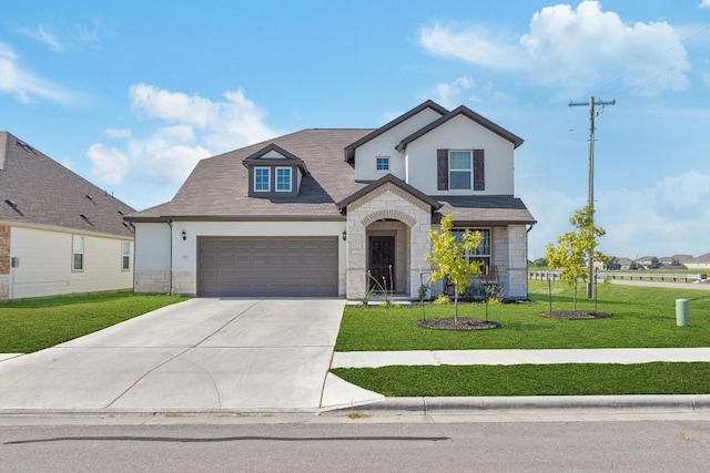 view of front facade with a garage and a front yard