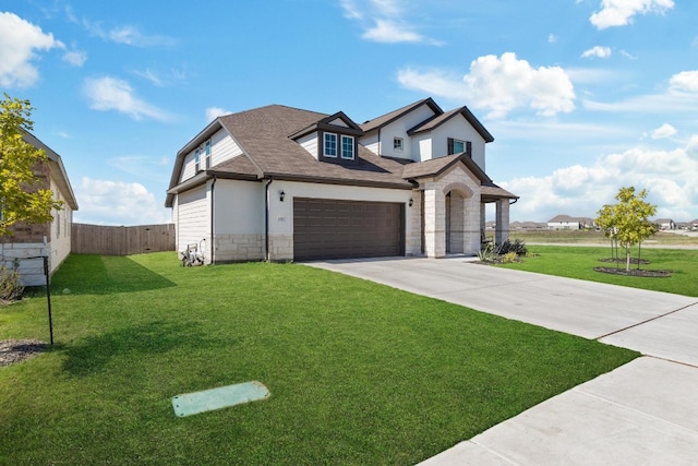 view of front facade featuring a garage and a front yard