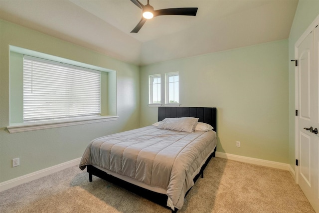 bedroom with light carpet and ceiling fan