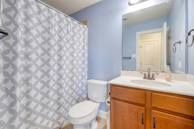 bathroom featuring vanity, tile patterned floors, toilet, and a shower with shower curtain