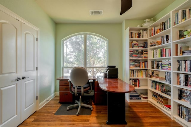 office space with dark wood-type flooring