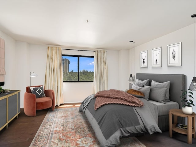 bedroom with hardwood / wood-style floors