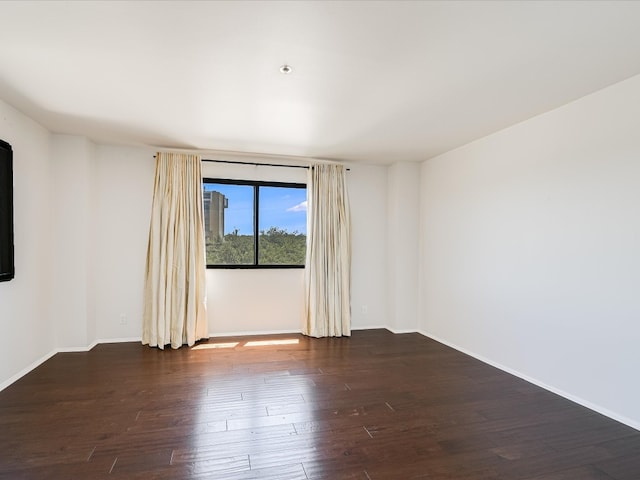 unfurnished room featuring wood-type flooring