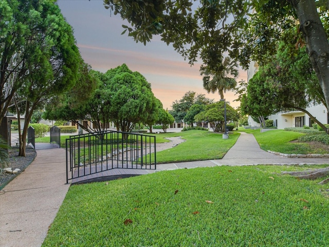 view of home's community featuring a lawn