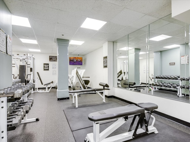 exercise room with a paneled ceiling