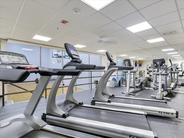 workout area with a paneled ceiling