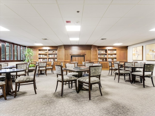 carpeted dining room with built in features