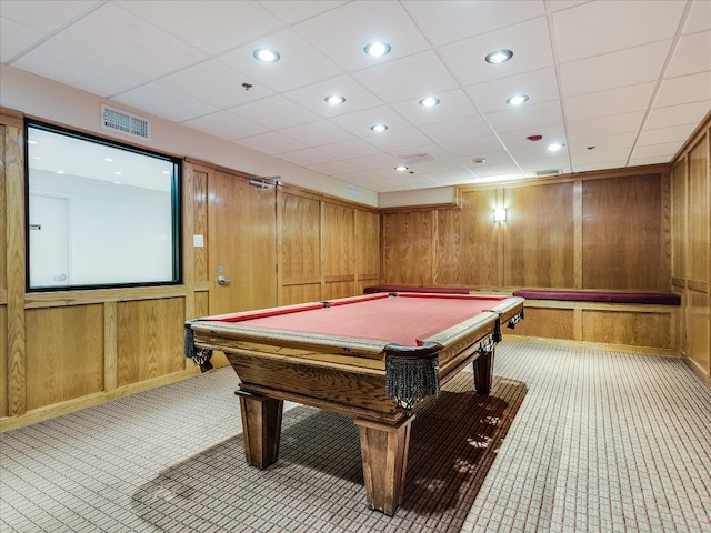 rec room with wood walls, pool table, and a paneled ceiling