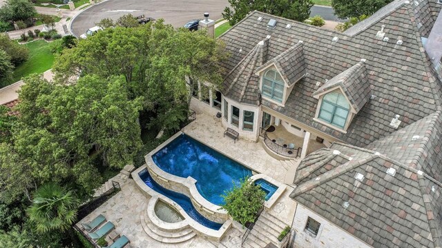 2413 Never Bend Cv, Austin, TX 78746 - swimming pool featuring a patio