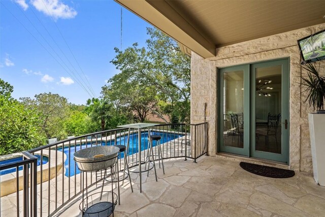 2413 Never Bend Cv, Austin, TX 78746 - balcony featuring a patio