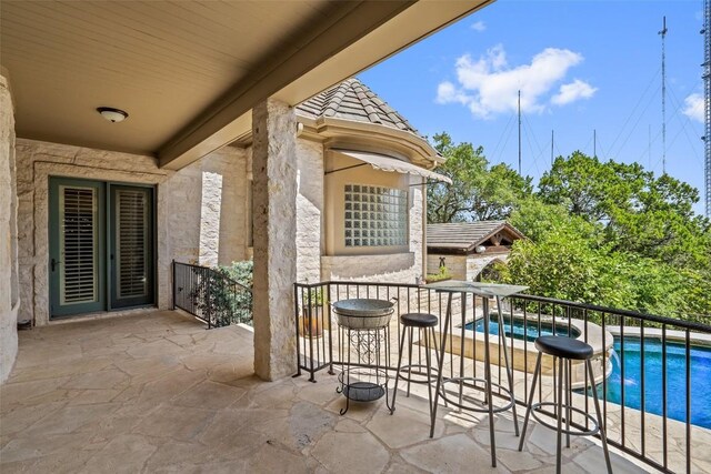 view of patio featuring a fenced in pool