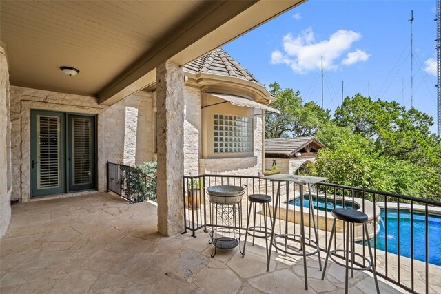 2413 Never Bend Cv, Austin, TX 78746 - view of patio / terrace with an outdoor pool