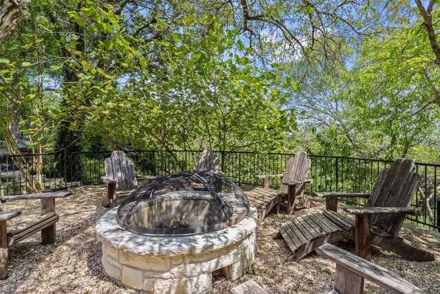 2413 Never Bend Cv, Austin, TX 78746 - view of patio featuring an outdoor fire pit
