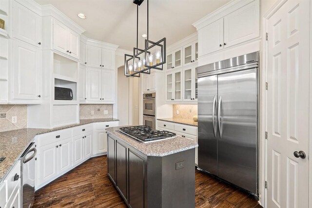 2413 Never Bend Cv, Austin, TX 78746 - kitchen with stainless steel appliances, open shelves, a chandelier, white cabinets, and dark wood-type flooring