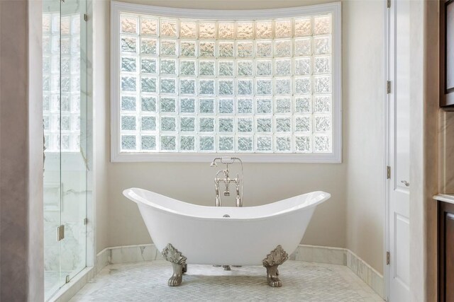 2413 Never Bend Cv, Austin, TX 78746 - bathroom with plenty of natural light, a soaking tub, and a stall shower