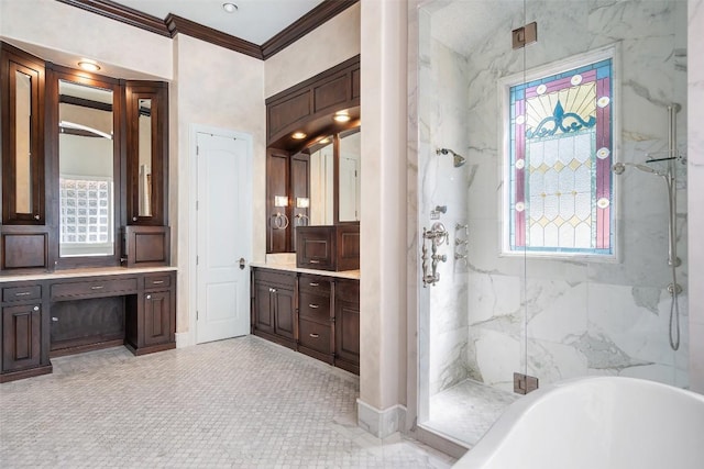 full bathroom with ornamental molding, a freestanding tub, a marble finish shower, and vanity