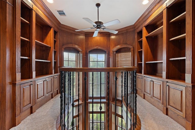 2413 Never Bend Cv, Austin, TX 78746 - unfurnished office with carpet flooring, crown molding, wooden walls, built in features, and ceiling fan