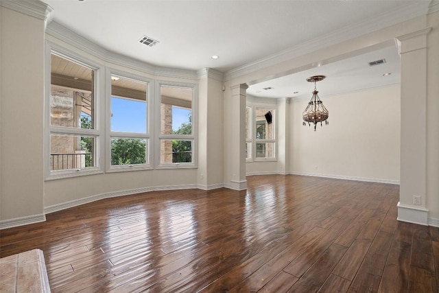 2413 Never Bend Cv, Austin, TX 78746 - spare room with decorative columns, a chandelier, dark wood-style flooring, crown molding, and baseboards