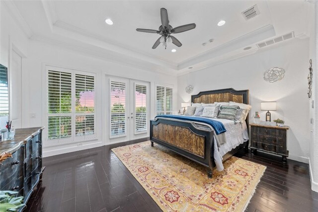 bedroom with ornamental molding, dark hardwood / wood-style floors, a raised ceiling, access to exterior, and ceiling fan