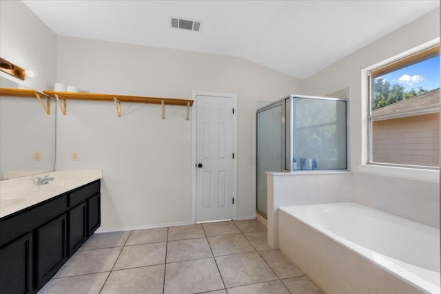 bathroom featuring tile patterned floors, plus walk in shower, vanity, and lofted ceiling