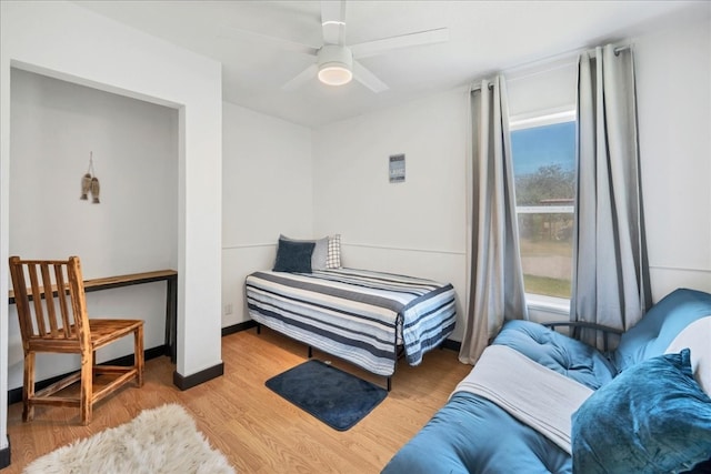 bedroom featuring ceiling fan and light hardwood / wood-style flooring