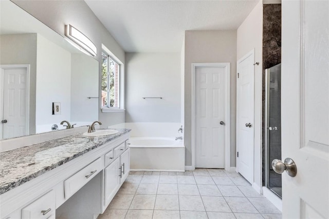 bathroom featuring a garden tub, tile patterned flooring, vanity, and a shower stall