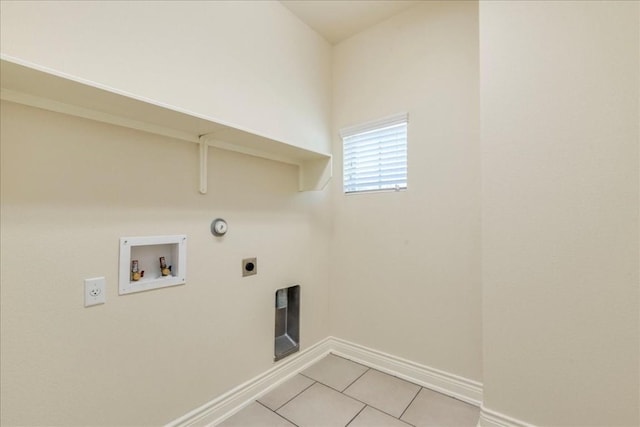 laundry area featuring laundry area, gas dryer hookup, washer hookup, electric dryer hookup, and light tile patterned flooring