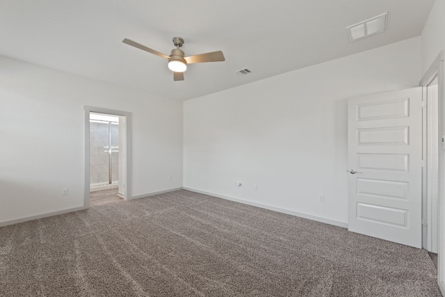 carpeted empty room with ceiling fan