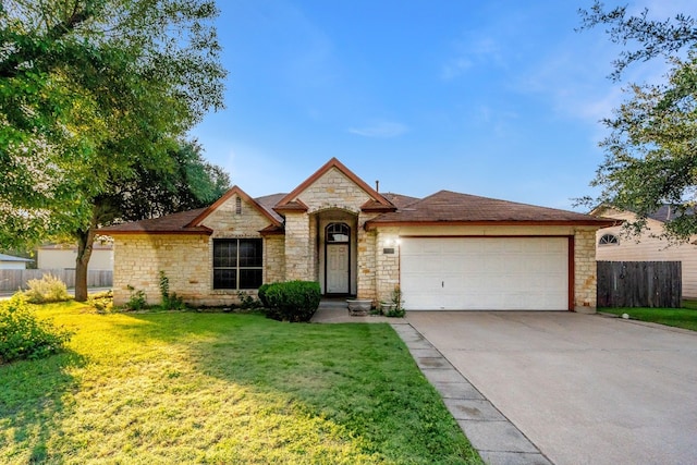 view of front facade with a front lawn and a garage