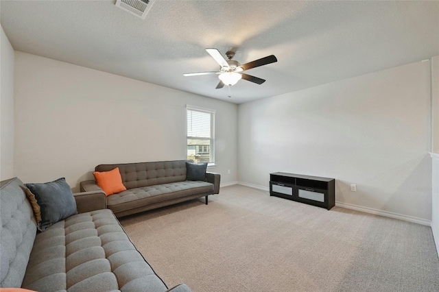 living room with ceiling fan and light carpet