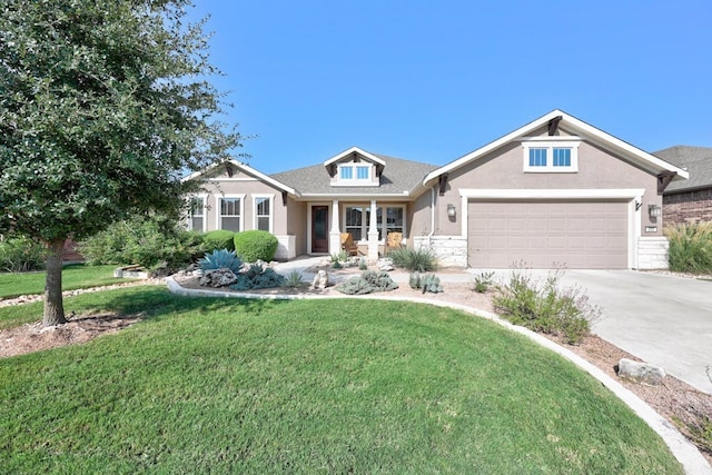 view of front of house with an attached garage, concrete driveway, a front yard, and stucco siding