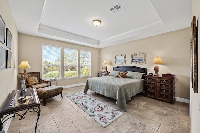 tiled bedroom with a raised ceiling