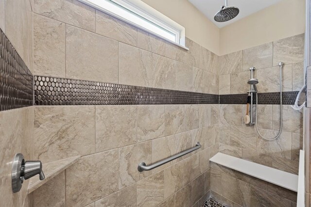 bathroom with a tile shower