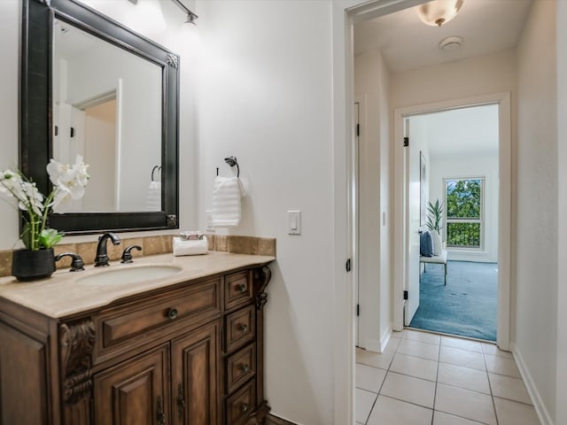 bathroom featuring tile patterned flooring and vanity