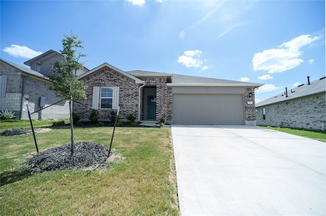 view of front of property featuring a front lawn and a garage