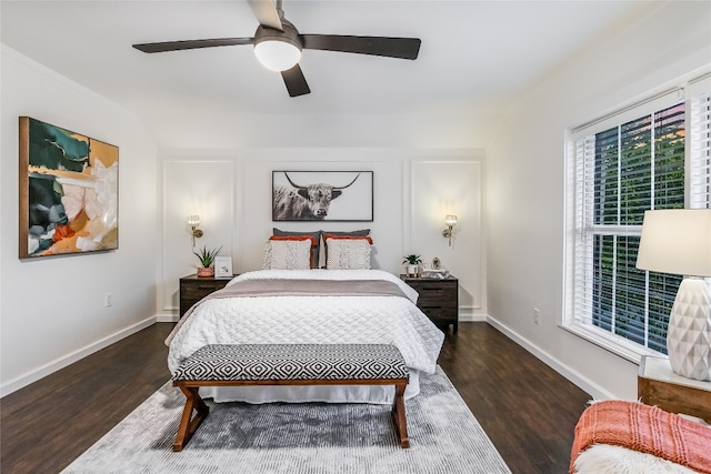 bedroom featuring ceiling fan and dark wood-type flooring