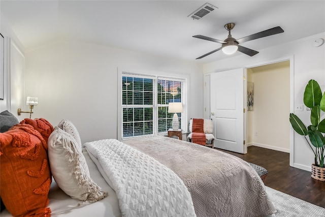 bedroom featuring ceiling fan, dark hardwood / wood-style floors, and lofted ceiling