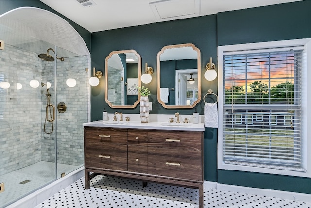 bathroom with vanity and a shower with shower door